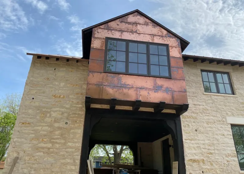 Copper metal panel facade on a stone building for Metal Roof Coating in Kerman